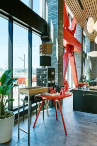 a room with a table and chairs at citizenM Seattle Pioneer Square in Seattle