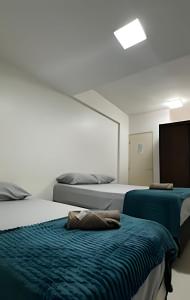 Ένα ή περισσότερα κρεβάτια σε δωμάτιο στο Beira mar incrivel na praia de pajuçara pertinho da roda gigante