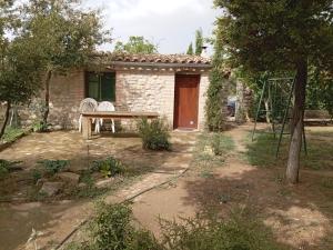 a house with a picnic table in front of it at Detached rural 19th century country house in Calonge de Segarra