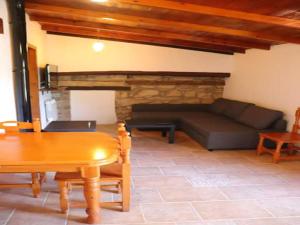 a living room with a couch and a table at Detached rural 19th century country house in Calonge de Segarra
