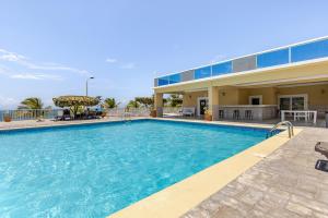 a large swimming pool in front of a building at Dream Diamond in Saint Annʼs Bay