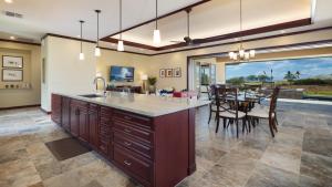 an open kitchen and dining room with a dining table at ❤PiH❤MAUNA KEA DREAM We ︎ Families Private Heated PoolSpa Stunning Views in Hapuna Beach
