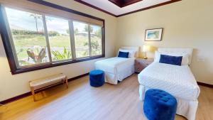 a bedroom with two beds and a window at ❤PiH❤MAUNA KEA DREAM We ︎ Families Private Heated PoolSpa Stunning Views in Hapuna Beach +51 photos