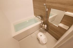 Koupelna v ubytování Plus Life Shiraho B