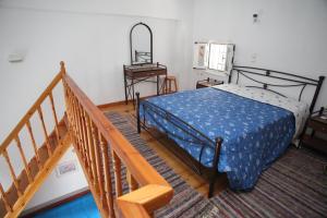 A bed or beds in a room at Afroditi Syros