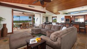 a living room with a couch and a table at SUNSET VILLA Spacious Mauna Lani 3BR Home With Private Beach Club in Waikoloa