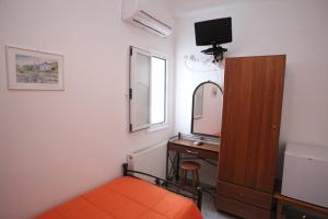 A bed or beds in a room at Afroditi Syros