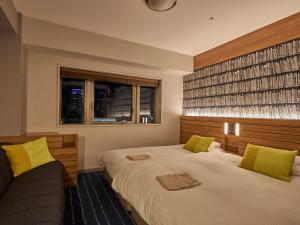 Ένα ή περισσότερα κρεβάτια σε δωμάτιο στο Hearton Hotel Nishi Umeda +59 φωτογραφίες