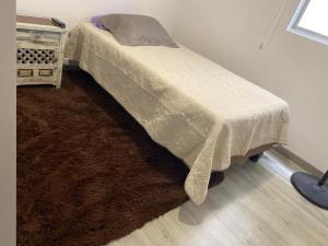 Ένα ή περισσότερα κρεβάτια σε δωμάτιο στο Apartamento Oasis en las Alturas