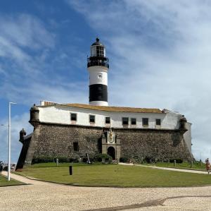 a lighthouse sitting on top of a building at Flat 502 América Tower, ao lado do Salvador Shopping in Salvador