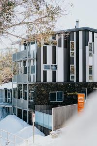 a building with black and white stripes on it at Elk at Falls in Falls Creek