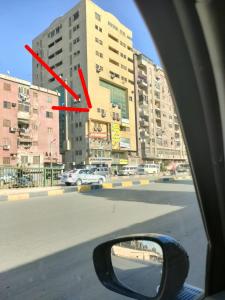 a view of a city street with a red arrow at Giza City Hotel-الجيزة سيتى اوتيل in Cairo