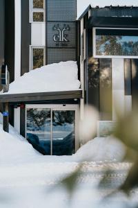 a building with snow on top of it at Elk at Falls in Falls Creek