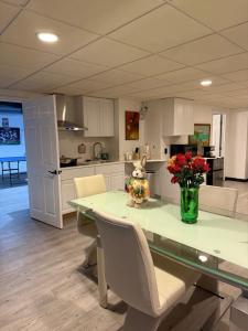 a teddy bear sitting on a table in a kitchen at Nice and Cozy! in Lincoln