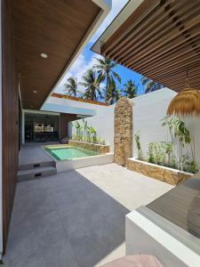 Bazén v ubytování Kelapa Villas - Villa Aire & Villa Alma nebo v jeho okolí