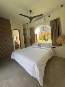 Postel nebo postele na pokoji v ubytování Kelapa Villas - Villa Aire & Villa Alma + 13 fotografií