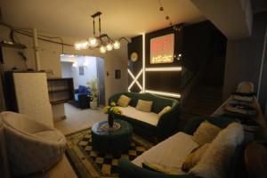 a living room with a couch and a table at Giza City Hotel-الجيزة سيتى اوتيل in Cairo