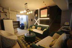 a living room with a couch and a table at Giza City Hotel-الجيزة سيتى اوتيل in Cairo