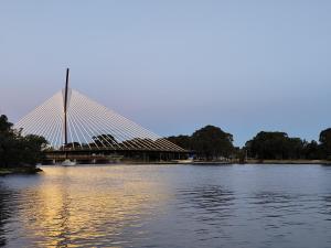 a bridge over a body of water at Kaivalya Niketan in Perth