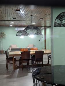a dining room with a table and chairs at Relax en San Nicolás in Villa San Nicolás