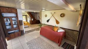 a room with a table and some utensils on the wall at Ave Surfing House in Mahina