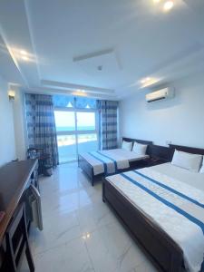 Ένα ή περισσότερα κρεβάτια σε δωμάτιο στο Khu Nghỉ Dưỡng Đoàn 298 - Khách Sạn 3 Tầng