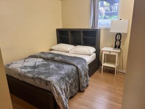 a small bedroom with a bed and a window at Gull lake in Winnipeg