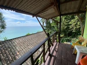 a deck with a view of the ocean at maylamean bungalows kohchang in Ban Khlong Son +91 photos