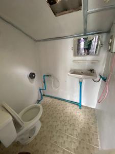 a bathroom with a toilet and a sink at maylamean bungalows kohchang in Ban Khlong Son