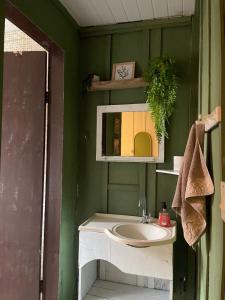 a bathroom with a sink and a mirror at Santo Gole Ilha Do Mel in Ilha do Mel +55 photos