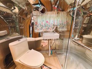 a small bathroom with a toilet and a sink at Moyard Khaoyai in Ban Khanong Phra Klang (1) +26 photos