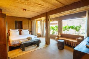 Postel nebo postele na pokoji v ubytování Anavya Farm villa