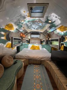 a train room with two beds and a couch at Moyard Khaoyai in Ban Khanong Phra Klang (1)