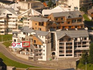 a building with a no parking sign in a city at Gourette: Appartement 6 pers, 2 pièces, Animaux admis - FR-1-860-30 in Gourette