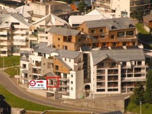 an apartment building with a no parking sign in a city at Gourette : Studio cabine 58m² pour 6 pers, Animaux admis - FR-1-860-32 in Gourette