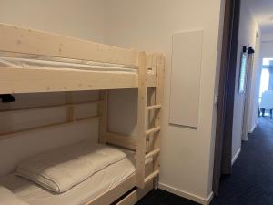 a couple of bunk beds in a room at Gourette : Studio cabine 58m² pour 6 pers, Animaux admis - FR-1-860-32 in Gourette +3 photos
