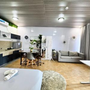 a living room with a table and a couch at Malaybalay Air’bnb Travellers Inn in Malaybalay +82 photos