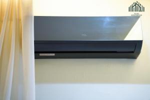 a flat screen tv hanging on a wall at Modern and spacious luxury villa for rent 2 bedrooms in Nouakchott