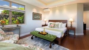 a bedroom with a bed and a living room at PUALANI VILLA Single Level 4BR KaMilo Home with Pool and Cottage in Waikoloa +72 photos