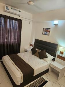 Ένα ή περισσότερα κρεβάτια σε δωμάτιο στο Darshanam Inn