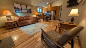 a living room with a couch and a table at Emerald Retreat in Eugene