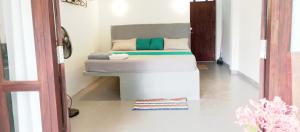 a bedroom with a bed in a room at MN House in Unawatuna