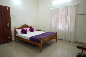 Postel nebo postele na pokoji v ubytování Pampatheeram Pallipurathucherry + 12 fotografií