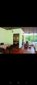 a living room with a table and a couch at Marari diya homestay in Mararikulam