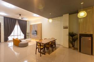 a living room with a table and a couch at #15mins walk to Kea Farm#4bedrooms4bathrooms#10pax in Brinchang