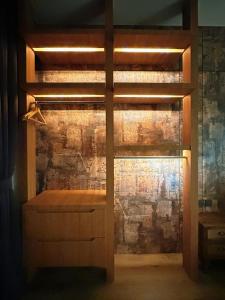 a bedroom with a bunk bed with a brick wall at #15mins walk to Kea Farm#4bedrooms4bathrooms#10pax in Brinchang +72 photos