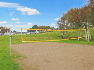 a volleyball net on a field in a park at 6 person holiday home in Gilleleje in Gilleleje
