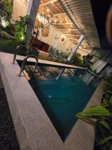 a swimming pool in front of a house at Sudu Colonial House 1929 in Ambalangoda