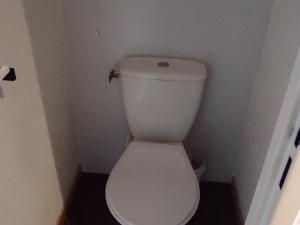a small bathroom with a white toilet in a room at Appartement Super Besse - 6 pers, Piscine, Parking, Balcon - FR-1-814-168 in Vassivière