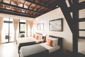 Postel nebo postele na pokoji v ubytování San Juan Surf Resort La Union + 55 fotografií